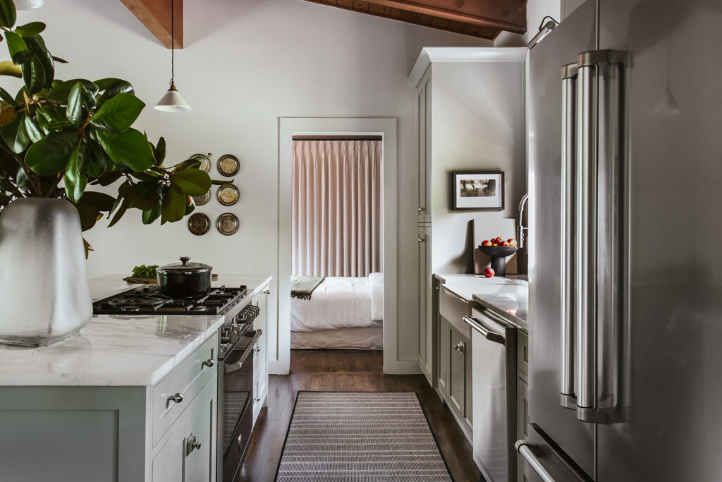 View of the kitchen into the primary suite.